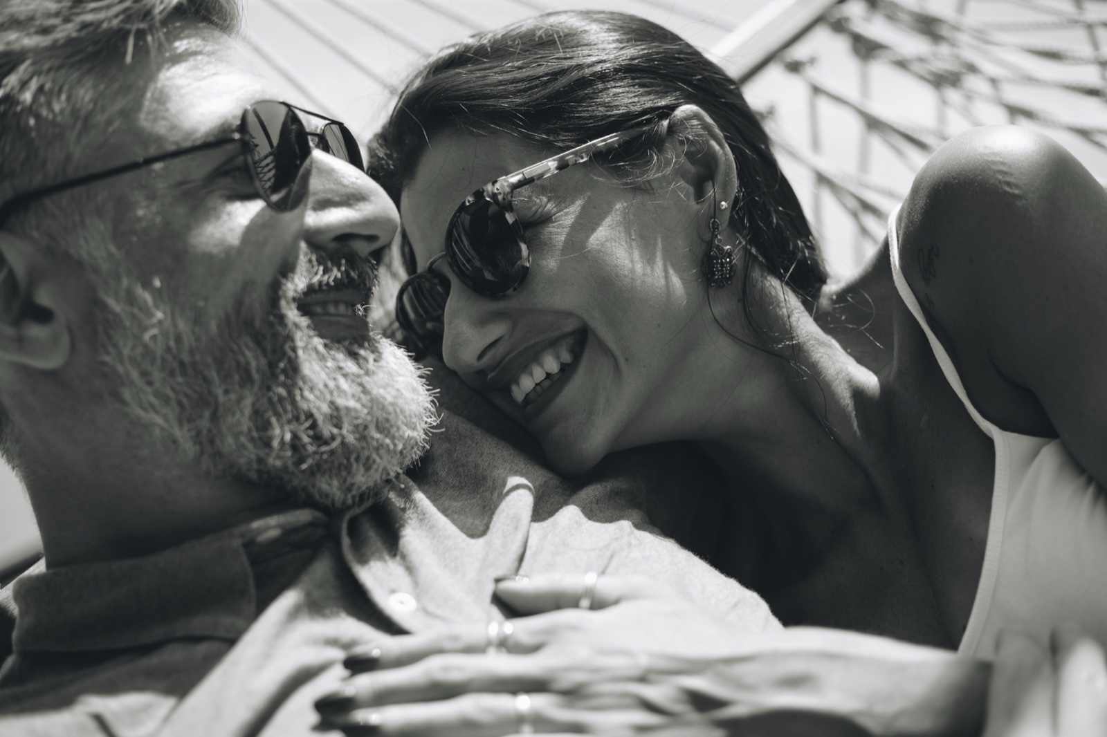 Smiling couple wearing sunglasses